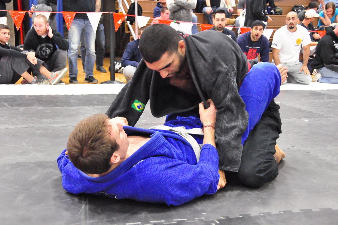Brazilian jiu-jitsu student training the closed guard position in a BJJ class